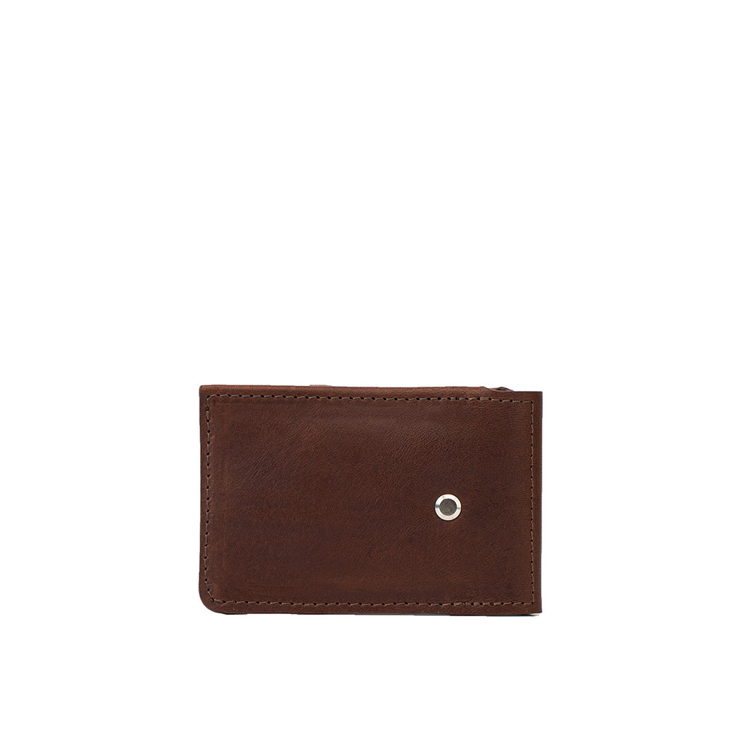 Mahogany leather AirTag money clip wallet for men, exterior view showing screw-secured tracker slot – Geometric Goods