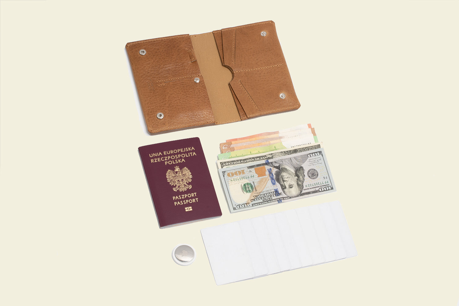 photo of the best air atag passport travel wallet for men and woman in light brown color which hold up to 7 cards and bills passport and airtag