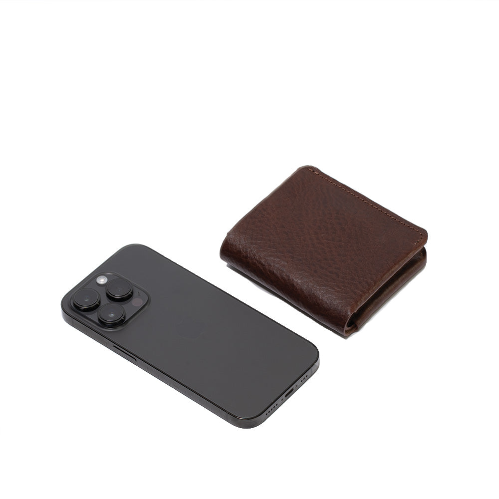 photo which compare the dimensions of the best airtag wallet for man and woman in dark brown color and iphone 14 pro