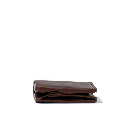 AirTag wallet with large coin punch made by Geometric Goods from premium Italian Leather in dark brown color folded photo