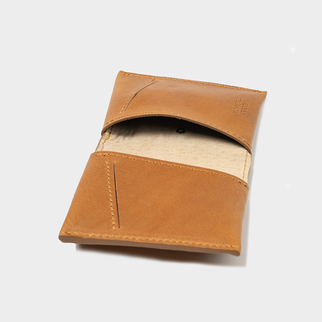 Premium cognac brown AirTag wallet for men, angled view showcasing compact design