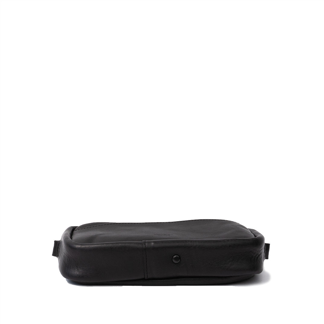 Compact black leather organizer bag closed view showing its sleek and structured design, perfect for daily essentials