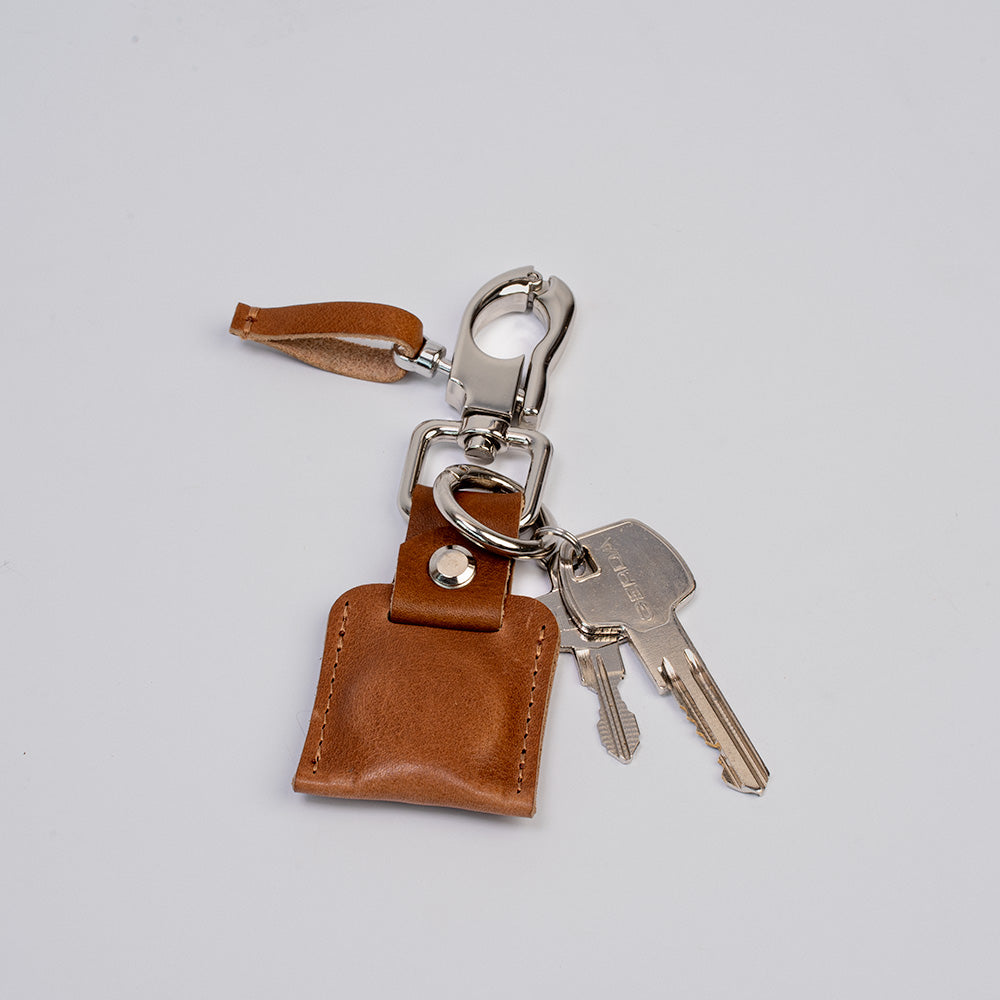 brown leather airtag keychain with snap hook and keyring