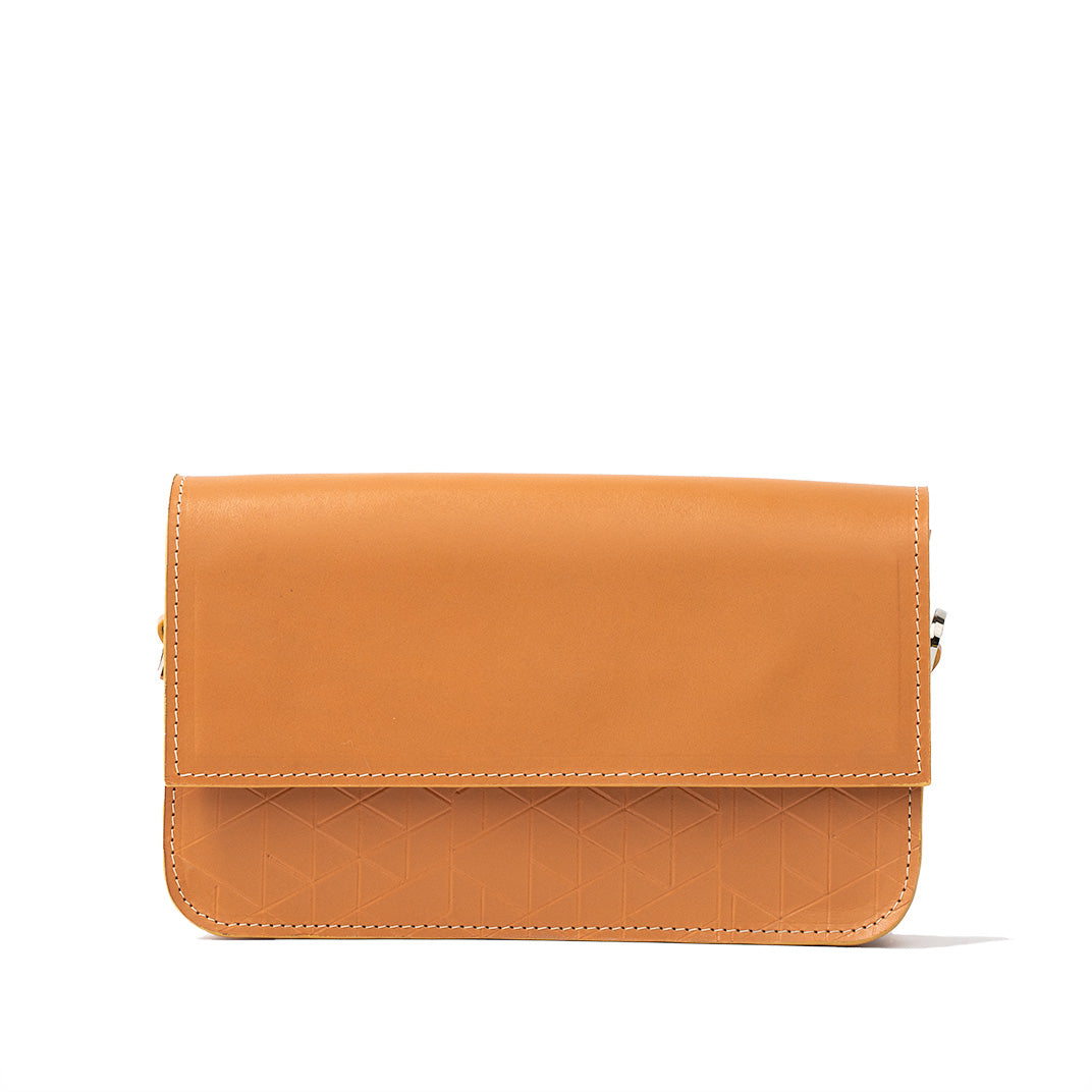 Elegant light orange shoulder bag with adjustable strap and embossed geometric pattern.