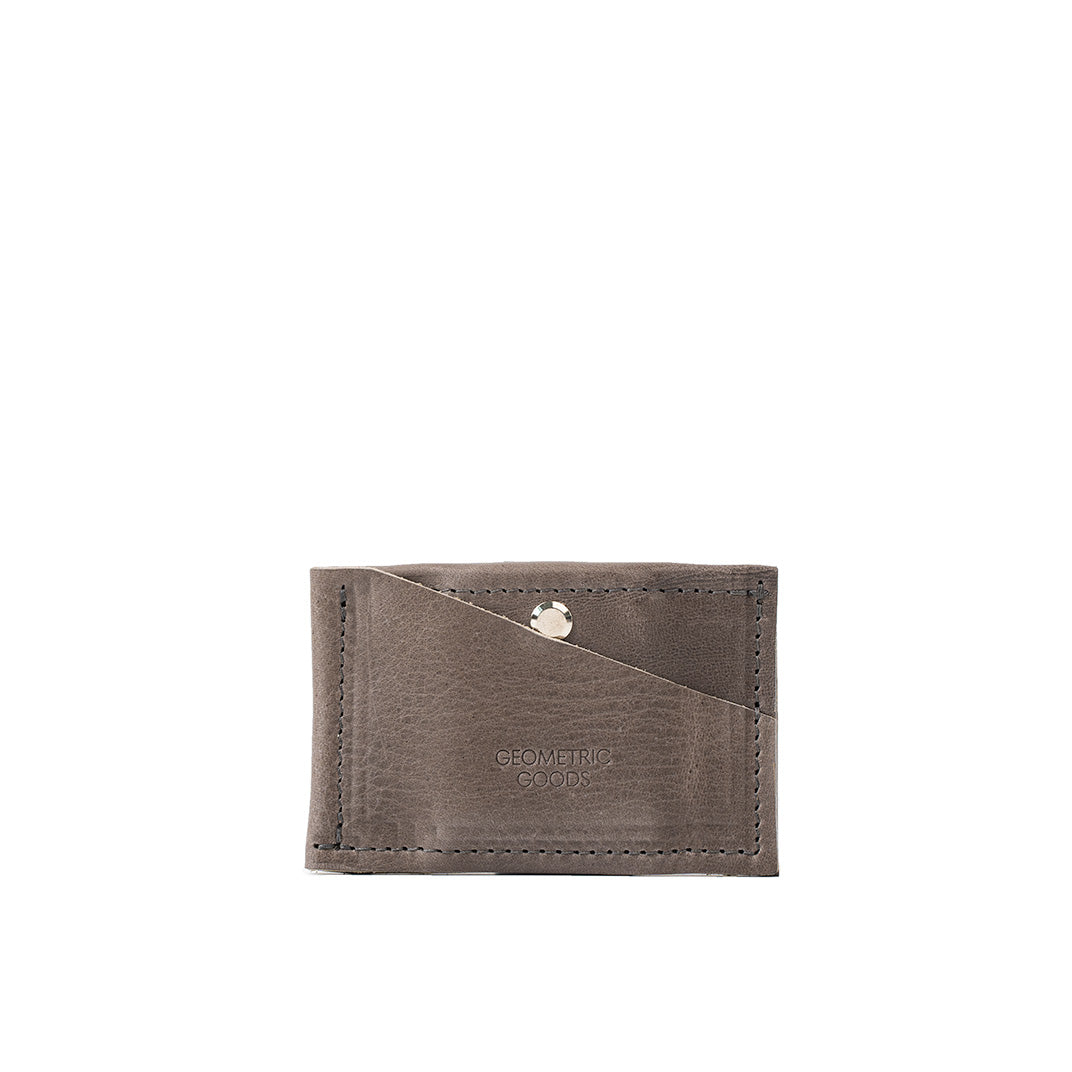 Gray compact AirTag wallet with a hidden pocket capable of holding up to seven cards, featuring secure storage for an AirTag