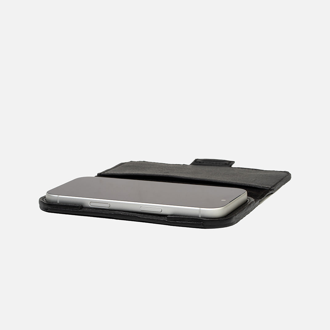 Side profile of iPhone 17 Series in Classic 5.0 leather folio — slim case-free feel, suede interior, low-profile magnetic strap, MagSafe-ready