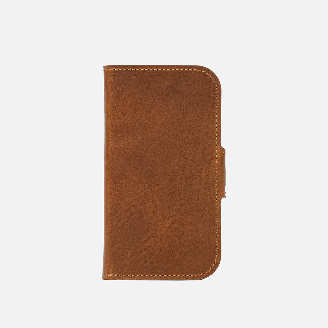 Front of closed brown leather iPhone 17 folio wallet with tab notch and curved corner – Geometric Goods