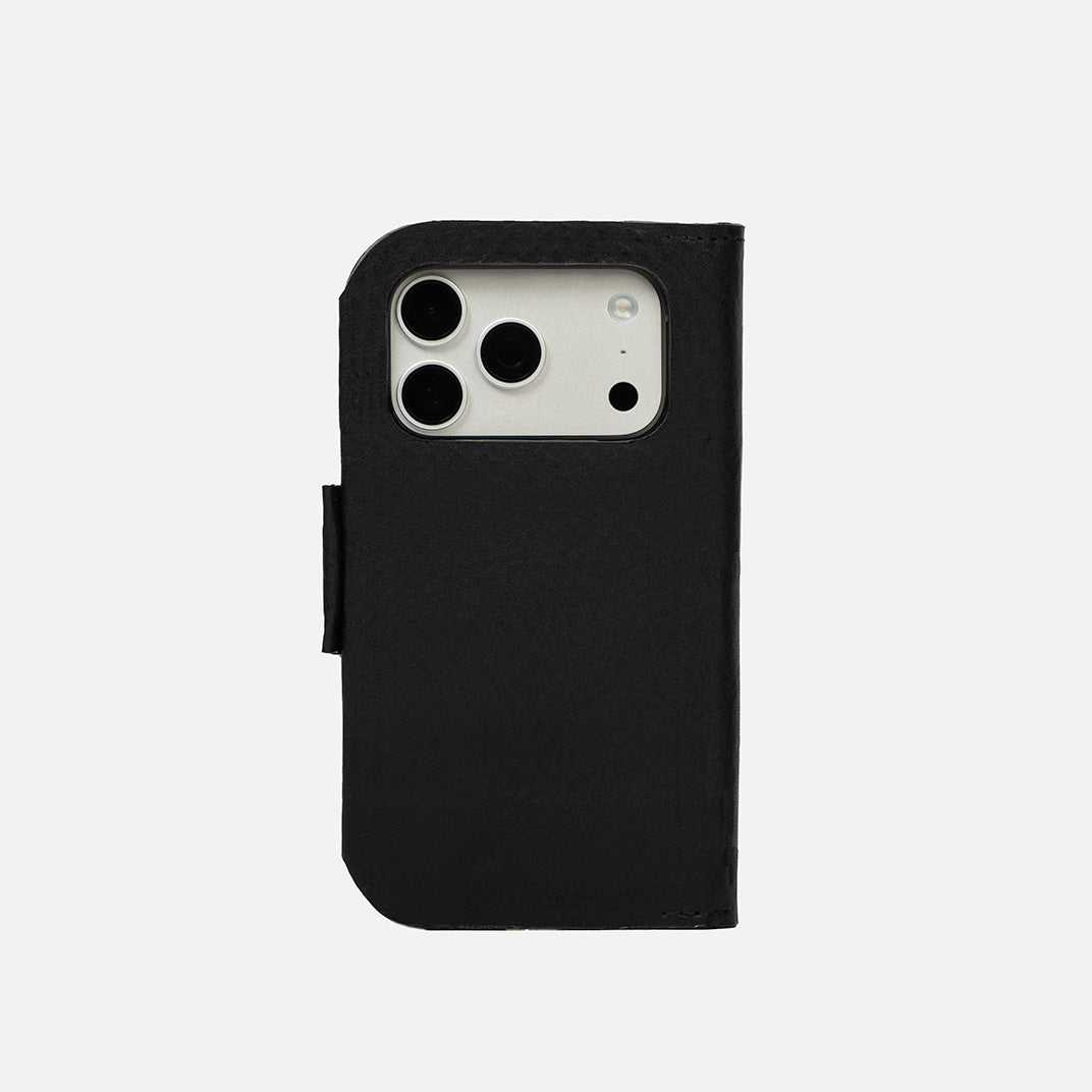 Black leather MagSafe folio on iPhone Air, back view with stitched edges and camera opening – Geometric Goods