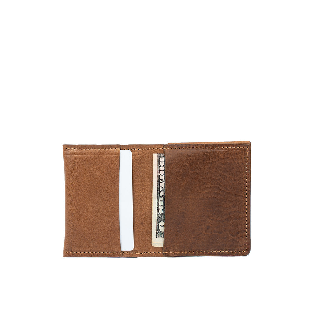 Open brown leather AirTag wallet with card slots and cash compartment. Crafted from premium leather with an AirTag slot for added security.