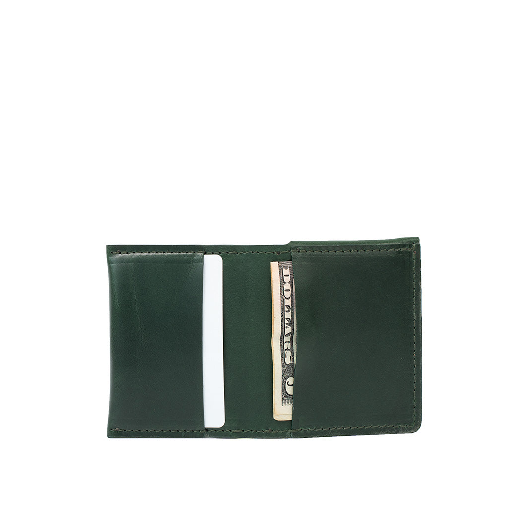 Open green leather AirTag wallet showing card slots and cash compartment. Sleek minimalist design with an AirTag slot for secure tracking.