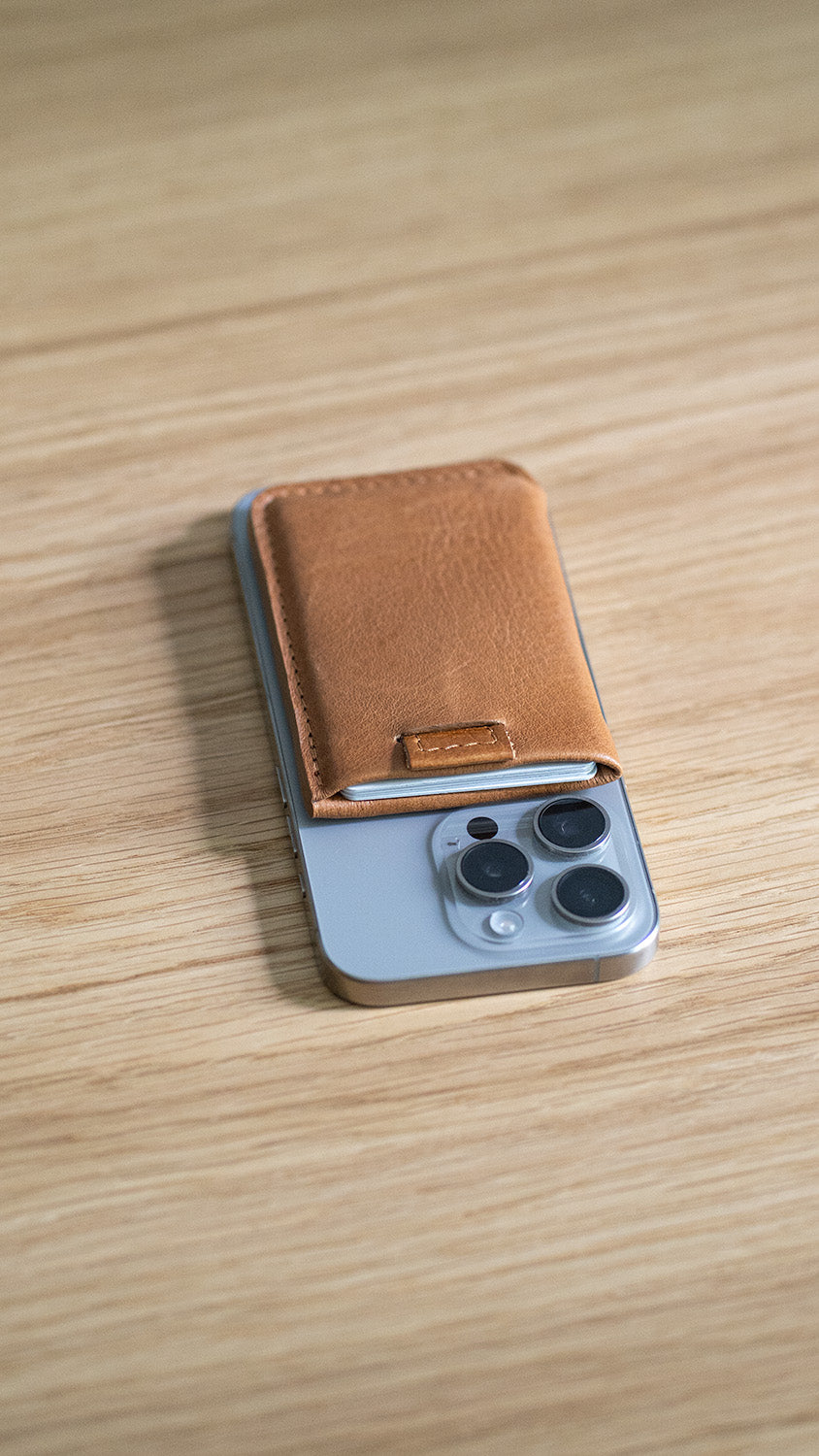 Slim brown MagSafe wallet on iPhone – minimalist leather wallet made in Italy, perfect for everyday carry