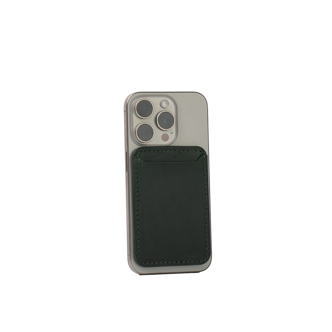 Forest green top-grain leather MagSafe wallet for iPhone, classic design, handcrafted from Italian leather, shown on iPhone