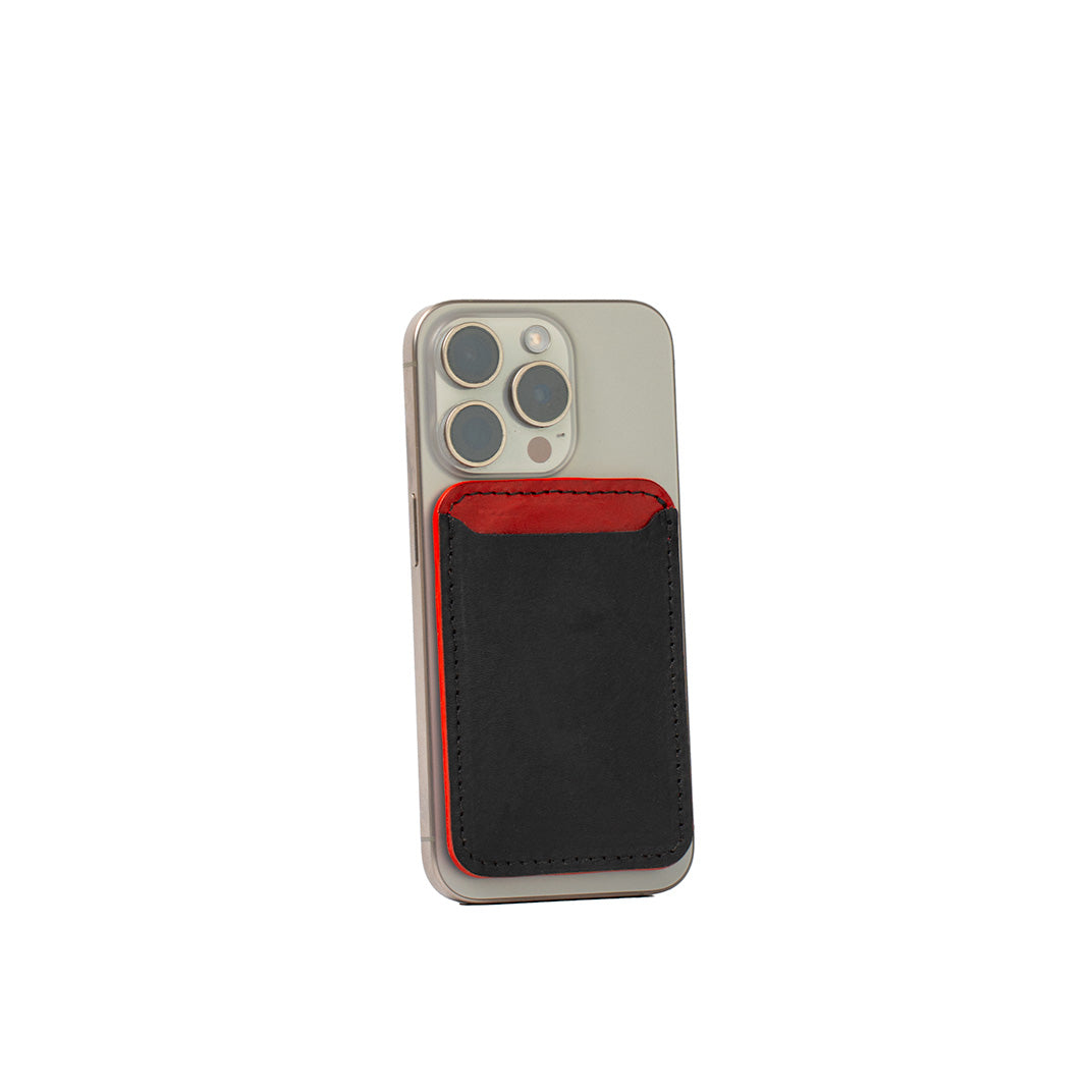 Two-tone MagSafe wallet for iPhone in black and red, luxury Italian leather, minimalist card holder with bold contrast design, handcrafted for secure fit