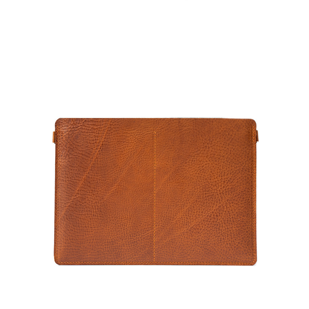 leather bag sleeve for MacBook Pro "The Minimalist 4.0" made by Geometric Goods from vegetable tanned leather in cognac brown (tan) color