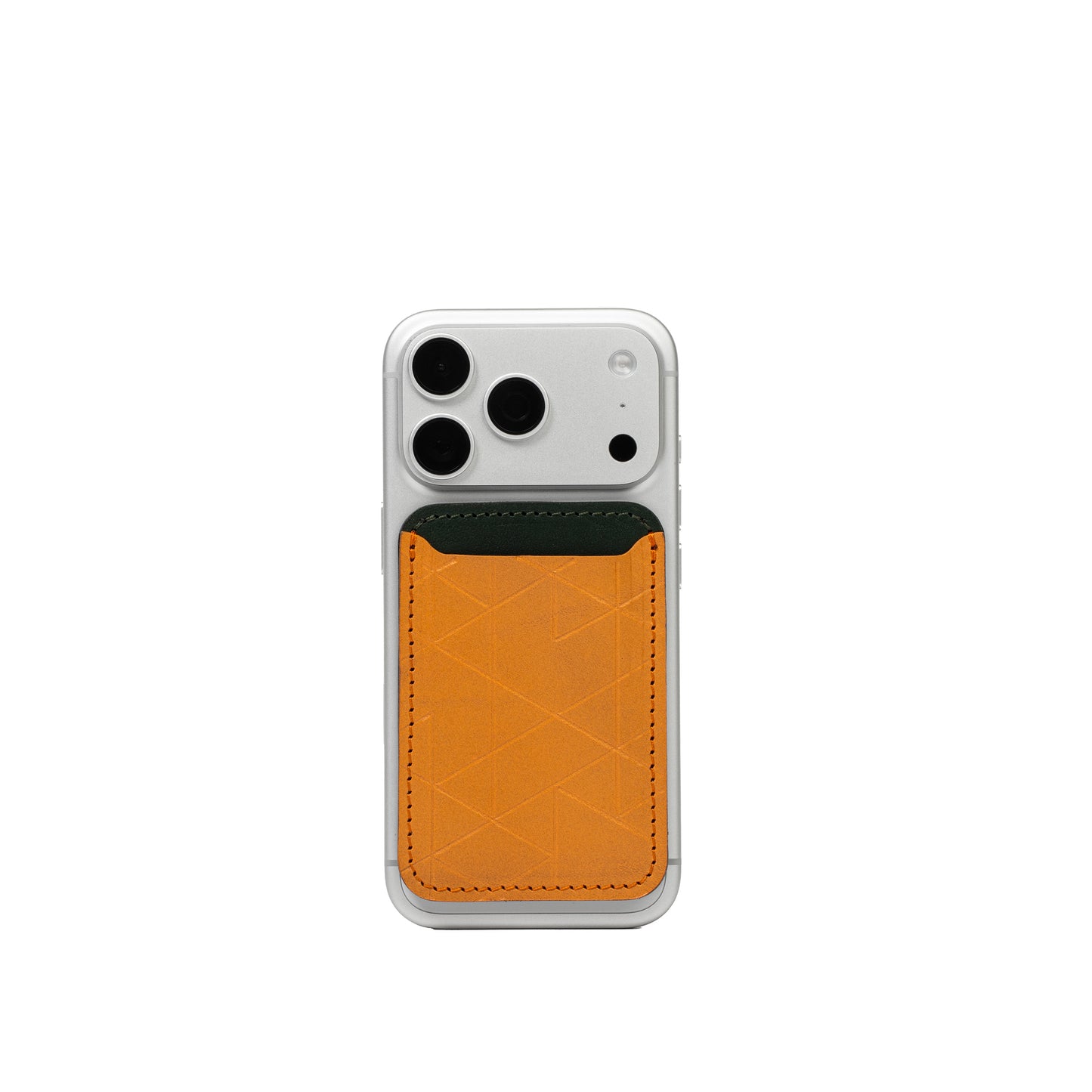 MagSafe leather wallet in Deep Saffron Vectors with forest-green top on iPhone — veg-tanned top-grain leather, holds 2–4 cards, Apple-approved magnet