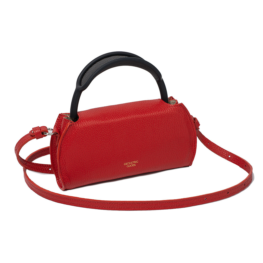 Angled view of Gometric Goods’ Ruby Red Leather AirPods Max Shoulder Case, featuring the brand logo and adjustable strap