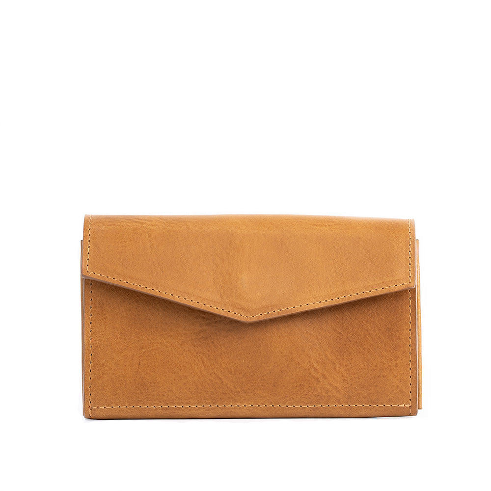 Closed camel leather AirTag wallet with a pointed flap.