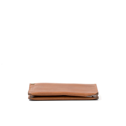 Top-quality AirTag passport case by Geometric Goods in brown color, crafted from premium brown Italian leather.