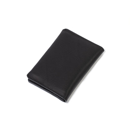 Geometric Goods' AirTag travel passport wallet, crafted from premium black Italian leather.