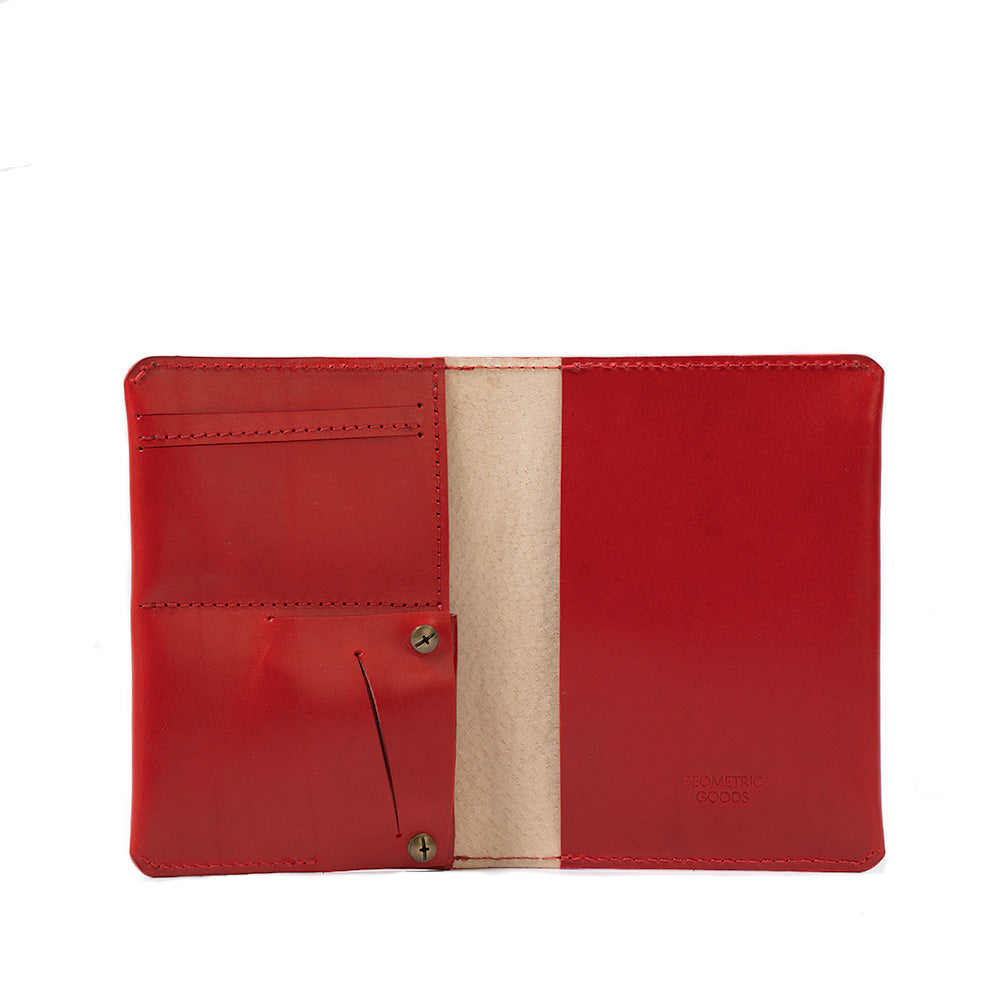 Woman's passport holder compatible with Apple AirTag in red, crafted by Geometric Goods from premium Italian leather.