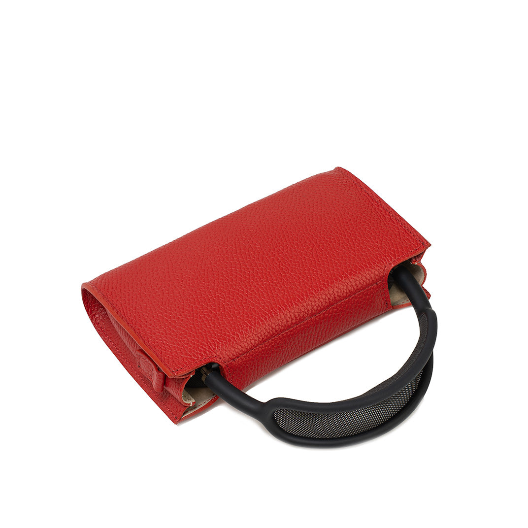 Red genuine Italian leather AirPods Max case, three-quarter top view with arched headband and partially open side