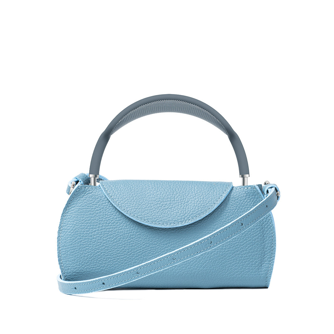 Sky blue leather AirPods Max case with adjustable shoulder strap, minimalist rounded flap design for stylish headphone protection