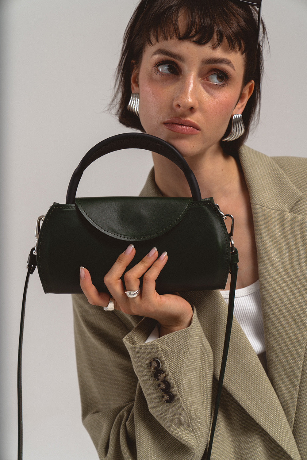 Premium leather AirPods Max shoulder case – worn by model, doubles as stylish handbag for Apple headphones