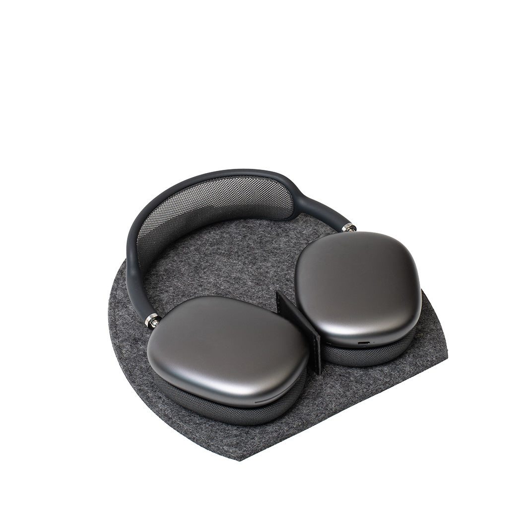 AirPods Max headphones on Rest Station 2.0 in grey wool felt – stand with low power mode activation