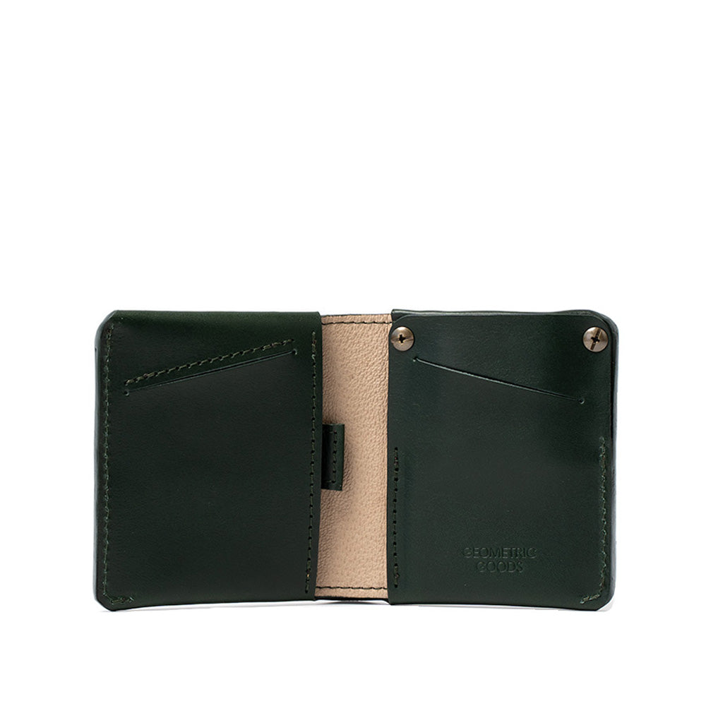 Geometric Goods women's AirTag wallet in forest green, premium top-grain Italian leather with hidden slot.