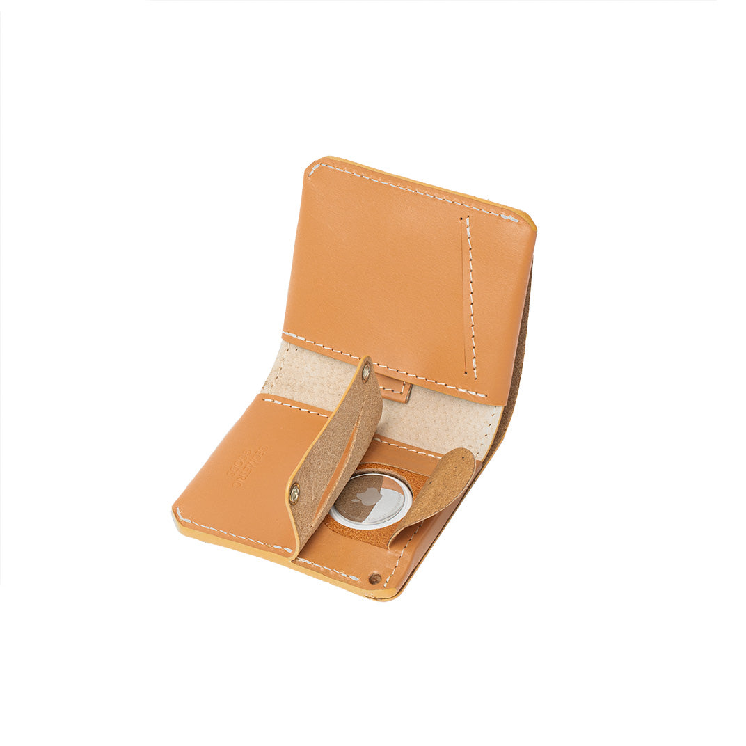 AirTag wallet for women in light orange color made from premium leather