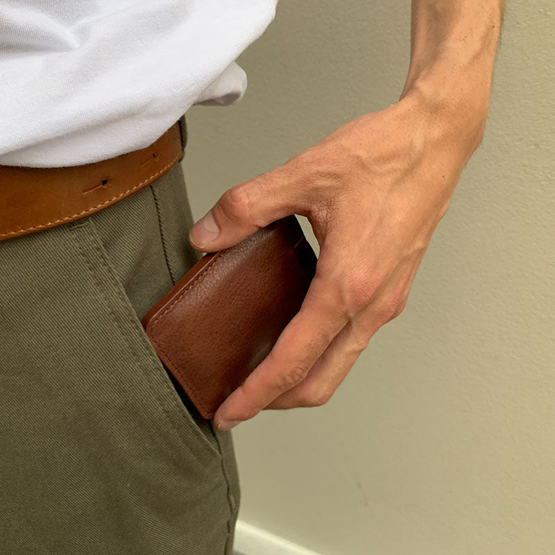 the photo of the best men's minimalist airtag wallet which fits in a pocket made by Geometric Goods from brown premium italian ful-grain leather