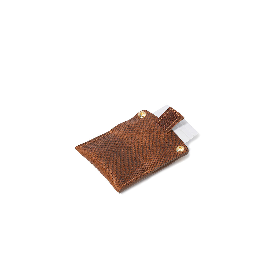 Apple AirTag wallet card in brown snake print leather, featuring secure card slots and customizable rivets