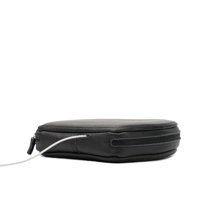 Side view of black AirPods Max leather case with zip closure and cable opening visible