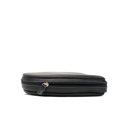 Slim side profile of black flat-grain leather AirPods Max case with zip-around closure
