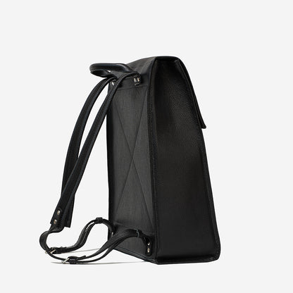 Back angled view of black leather commuter bag with adjustable straps and reinforced stitching
