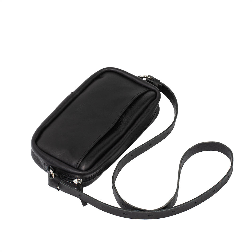 Black leather organizer bag with adjustable strap attached, showcasing its adaptability and comfort for daily use