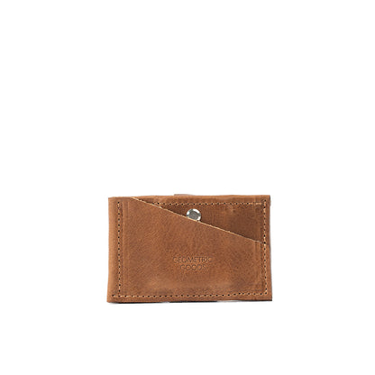 Stylish brown AirTag wallet with a compact design, equipped with a hidden AirTag pocket and a snap closure, capable of holding up to seven cards securely.