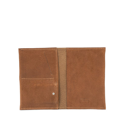 Brown leather AirTag passport holder 2.0 offering a traditional and sophisticated style