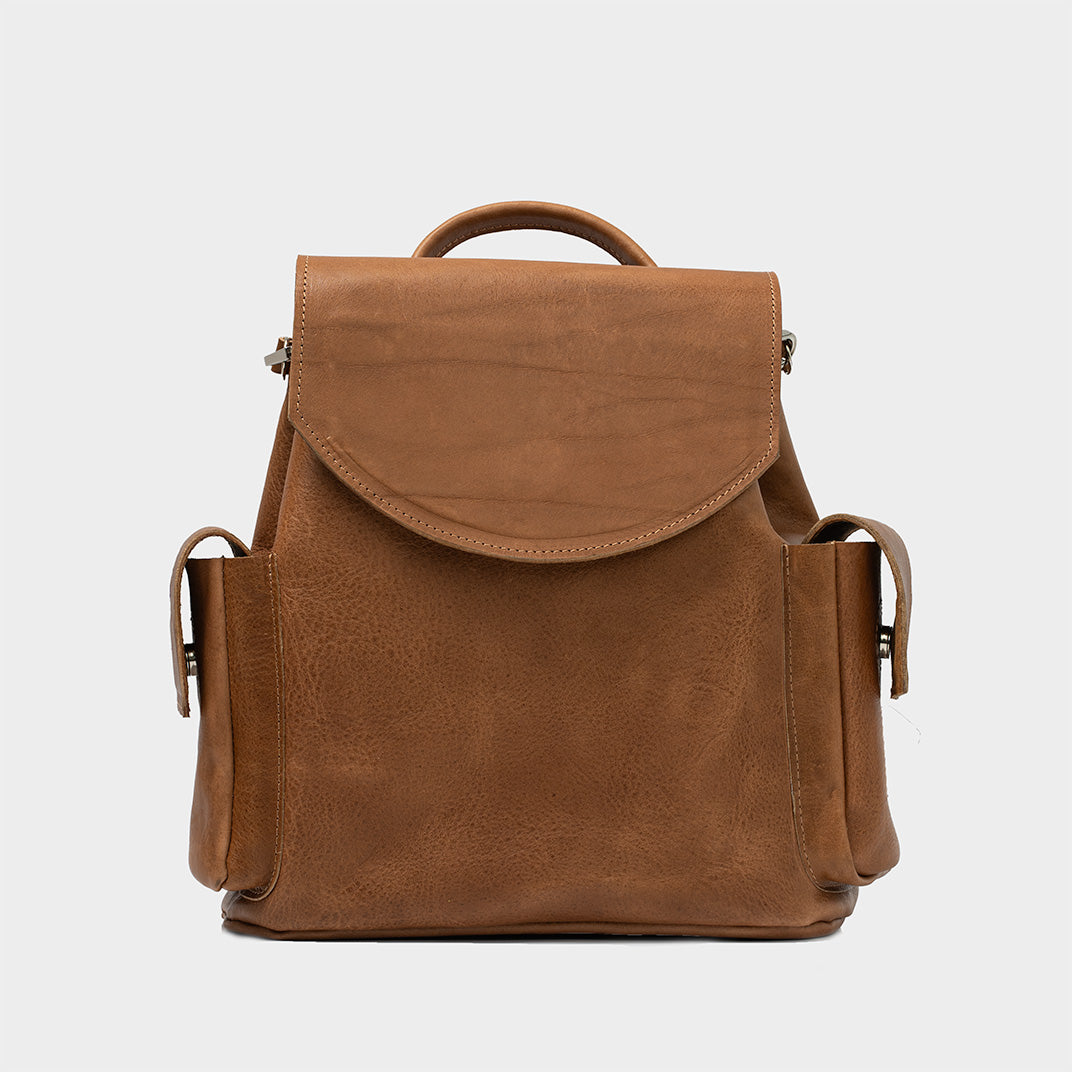 Brown mini leather rucksack for women, with multiple compartments and stainless steel hardware for durability and style