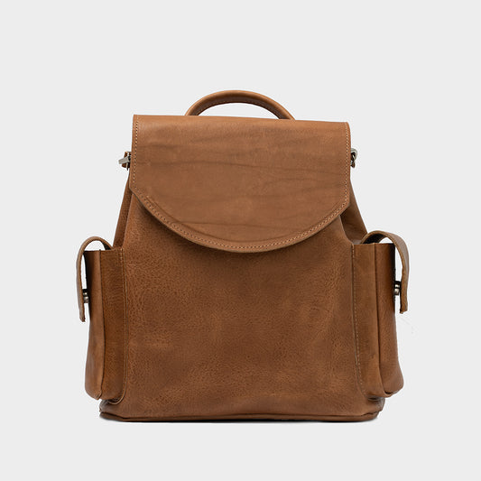 Brown mini leather rucksack for women, with multiple compartments and stainless steel hardware for durability and style