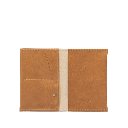 Camel leather AirTag passport holder 2.0 designed for secure and stylish travel