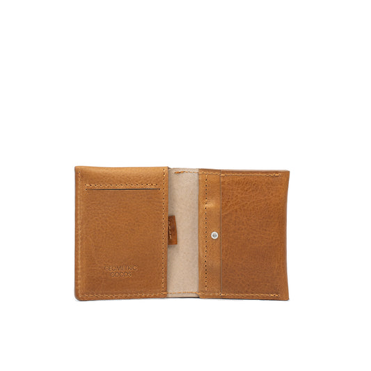 Interior view of camel leather AirTag card wallet showing compartments for cards and cash