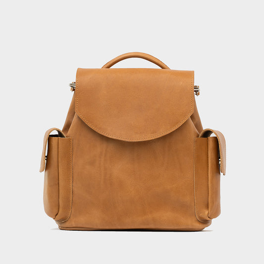 Front view of a camel leather designer backpack purse for women, small and stylish, crafted from premium Italian vegetable-tanned leather