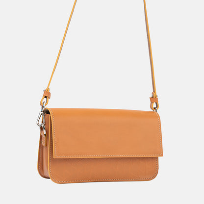 Designer light-orange leather shoulder purse with adjustable strap and vectors pattern