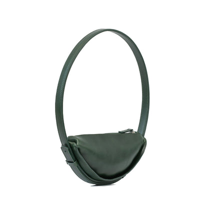 Shoulder bag styled as a half moon bag in forest green leather, highlighting the crescent bag's chic profile and subtle elegance