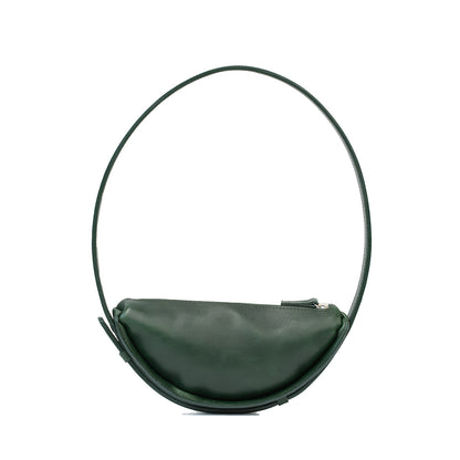 Shoulder bag designed as a half moon bag in deep green leather, showcasing the crescent bag's elegant curve and modern aesthetic.