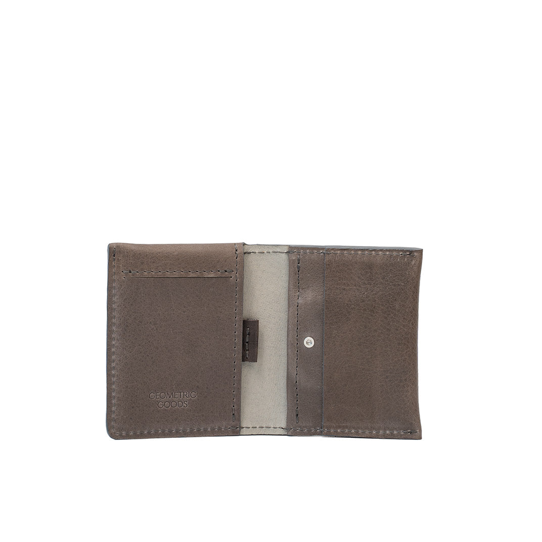 Open view of gray leather AirTag card wallet highlighting card slots and hidden AirTag compartment