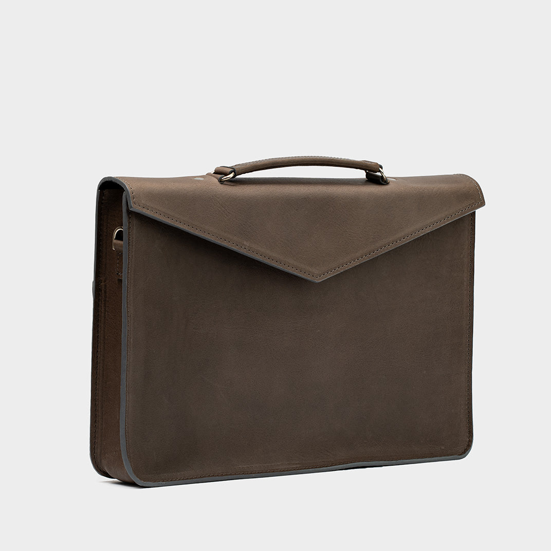 Elegant gray leather briefcase designed for professionals, showcasing premium Italian vegetable-tanned leather with a sleek finish, spacious padded laptop compartment, and secure zippered pockets for optimal organization.