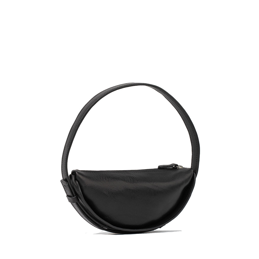 Handcrafted black leather crescent-shaped shoulder bag with a smooth surface and sturdy zipper