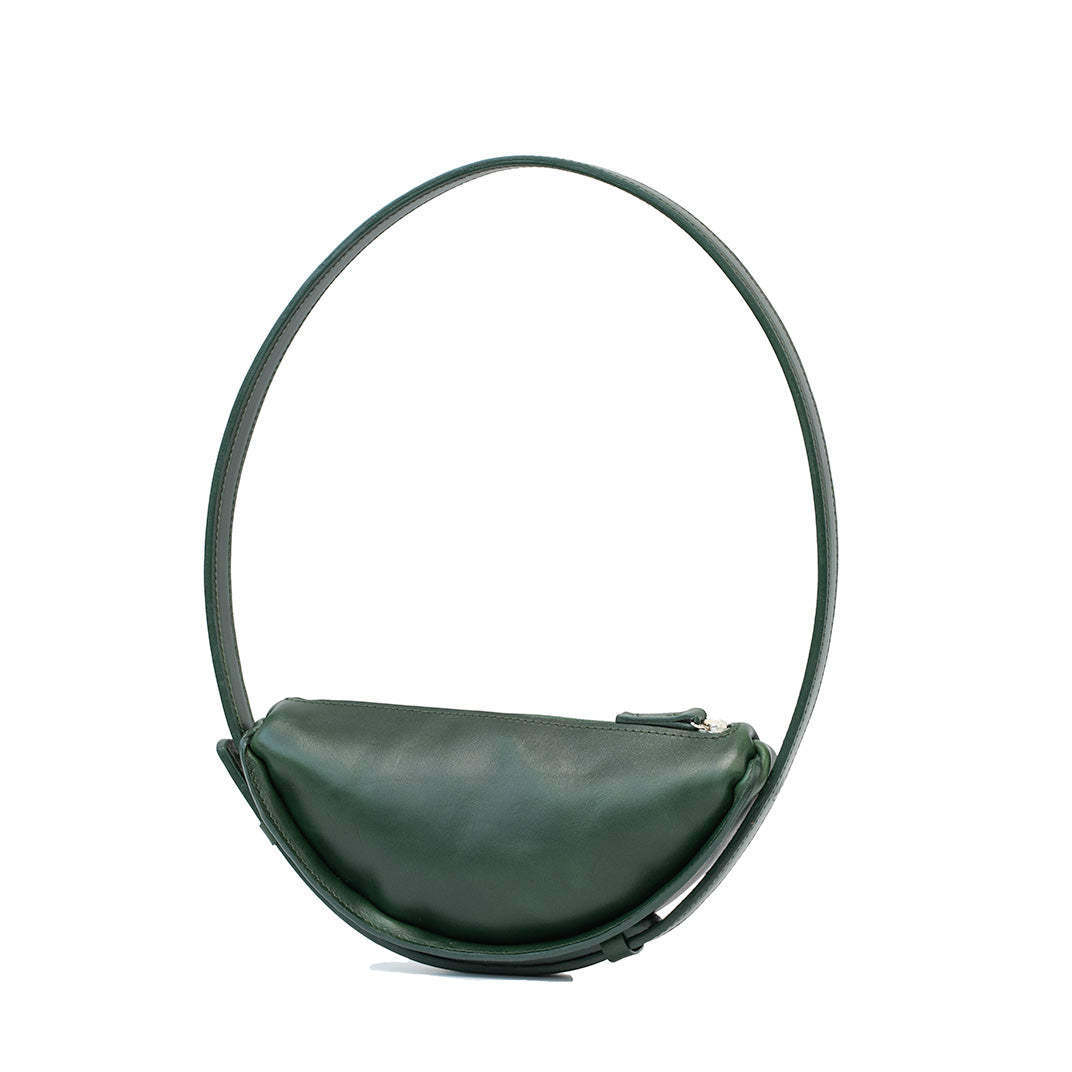 Shoulder bag crafted as a half moon bag in luxurious green leather, featuring a crescent bag’s sleek silhouette and refined design